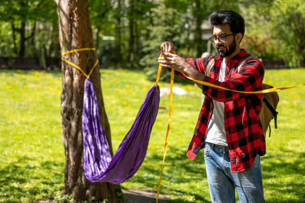 stuffing lightweight nylon hammock into small drawstring bag quick packing