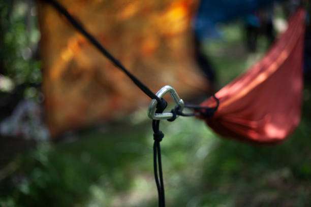 Carabiner and rope attaching a red hammock